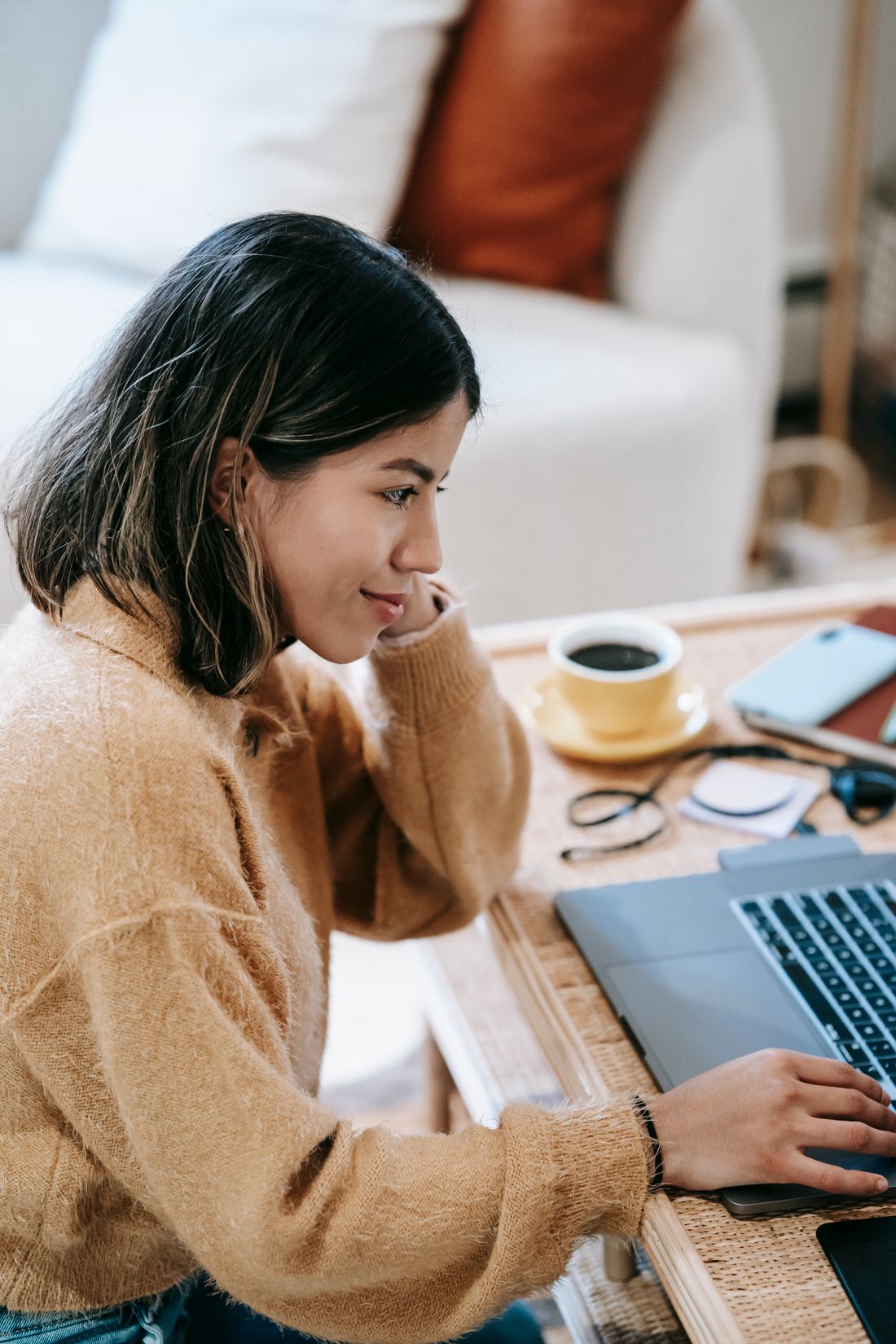 A young woman taking the Texas driving safety course online at home to dismiss a ticket